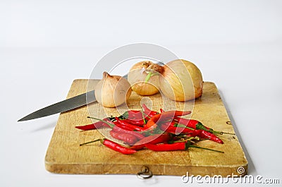 Chili and onion with kitchen tools on white background Stock Photo