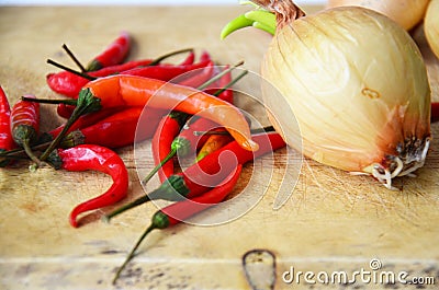 Chili and onion with kitchen tools on white background Stock Photo