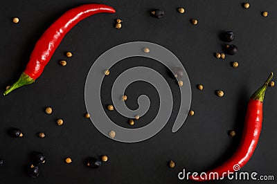 Chili pepper and different spices on a black background. Flat-lay, top view Stock Photo