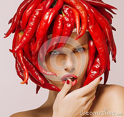 Glamour. Hot Chili Pepper on Shiny Woman's Face. Creative Concept Stock Photo