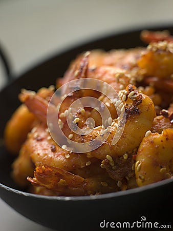 Chili and Sesame fried King Prawns Stock Photo