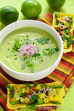 Chilled Avocado and Cucumber Soup. Spicy Mango Salsa Stock Photo