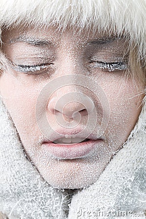 Chilled female face covered in ice Stock Photo