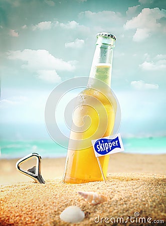 Chilled fruity soda or ale on the beach Stock Photo