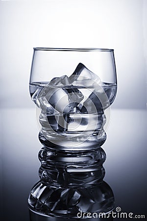 Chilled glass of water with ice cubes Stock Photo