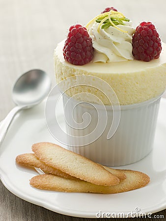 Chilled Lemon Souffle with Langue de Chat Biscuits Stock Photo