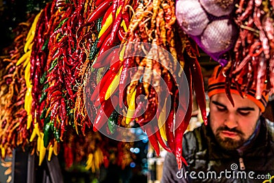 Chilli market stall with a dependent of the boqueria Editorial Stock Photo