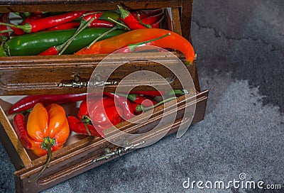 Chilli pepper, different types and colors, very original, with copy-space, in drawers Stock Photo