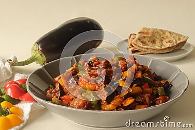 Chilly brinjal served as the side dish for indian flatbread. A indo chinese brinjal dish prepared with sauteed brinjal, chilly, Stock Photo