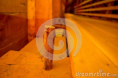CHILOE, CHILE - SEPTEMBER, 27, 2018: Close up of selective focus of wooden stick inside of historic church of Nercon Editorial Stock Photo