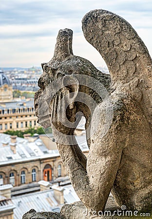 Chimera of the Cathedral of Notre Dame de Paris overlooking Paris Stock Photo
