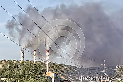 Chimney expelling pollutant gases to the air Stock Photo