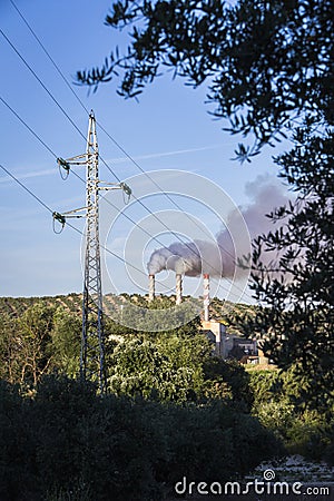 Chimney expelling pollutant gases to the air Stock Photo