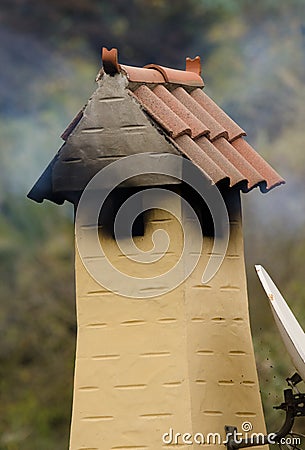 Chimney expelling smoke. Stock Photo