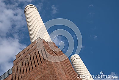 Chimneys at Battersea Power Station, renovated interwar building, now a mixed use retail and residential scheme. Stock Photo