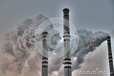 Chimneys poluting the planet - global warming Stock Photo