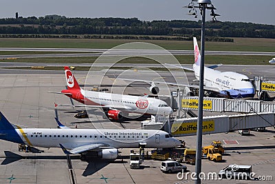 China Airlines Boeing 747-400, Niki Aiirbus a320 and Ukraine International Airlines Embraer erj190 parked at gate at Vienna Airpor Editorial Stock Photo