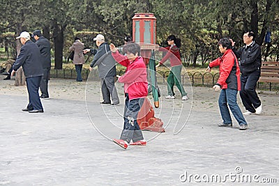 China, Beijing - April 10, 2012. Qigong in China. Qigong in the park Temple of the sky Editorial Stock Photo