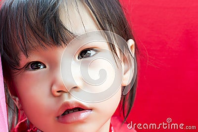 China girl in traditional Chinese red Tang suit greeting Stock Photo
