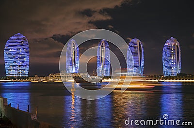 Pheonix Island Sanya illuminated buildings.Orange Bronze Unique modern Editorial Stock Photo