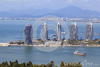 Pheonix Island Sanya illuminated buildings.Orange Bronze Unique modern Editorial Stock Photo