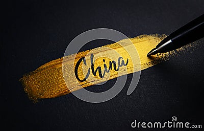 China Handwriting Text on Golden Paint Brush Stroke Stock Photo