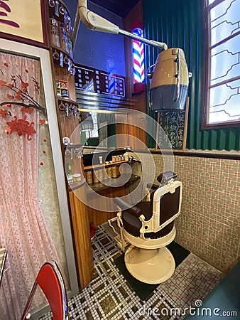 China Macau Cha Chaan Teng Restaurant Macao Coffee Shop Cafe Retro Interior Design Antique hairdresser barber Vintage Decoration Editorial Stock Photo