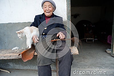 China's ethnic minorities, the Yi old lady Editorial Stock Photo