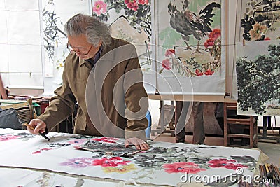 China, Suzhou - April 14, 2012. The Chinese artist paints paintings on the market in China Editorial Stock Photo