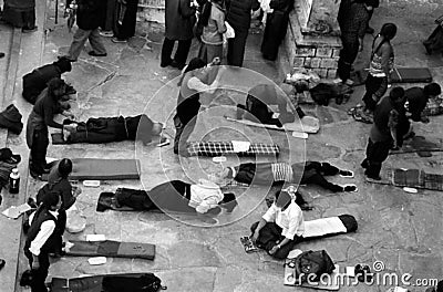 China-Tibet-Lhasa-December 2002 Buddhist worshipers pray in front of the JhoKang temple Editorial Stock Photo