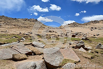 China, Tibet. Summer mountain landscape. Scattering of stones Stock Photo