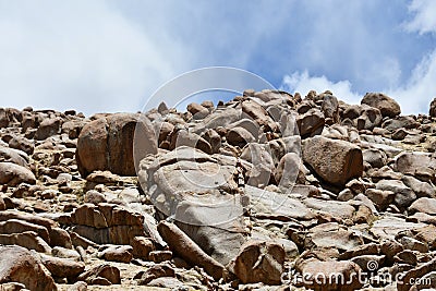 China, Tibet. Summer mountain landscape. Scattering of stones Stock Photo