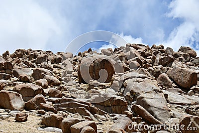 China, Tibet. Summer mountain landscape. Scattering of stones Stock Photo