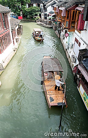 China traditional tourist boats on canals of Shanghai Zhujiajiao Water Town in Shanghai, China Editorial Stock Photo