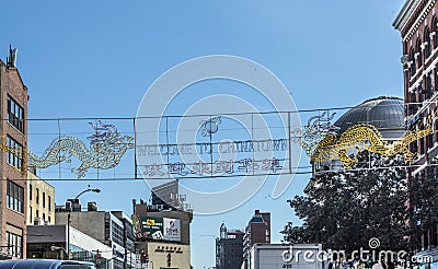 Chinatown with shops with chinese letters and pegasus in Chinatown, New York Editorial Stock Photo