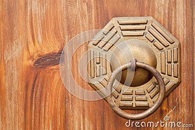 Chinese ancient bronze lock in wooden door. Stock Photo