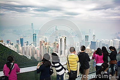 Chinese anonymous people looking at Hong Kong skyline from Victoria`s peak Editorial Stock Photo