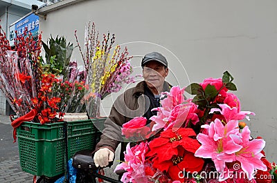 Chinese bicycle flower vendor on street, Shanghai China Editorial Stock Photo
