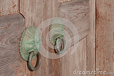Chinese bronze dragon knocker on wooden doors 17 Dec 2005 Stock Photo