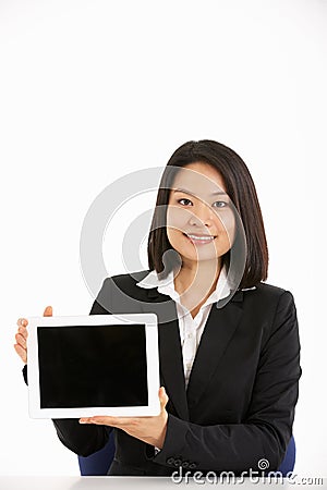 Chinese Businesswoman Working On Tablet Computer Stock Photo