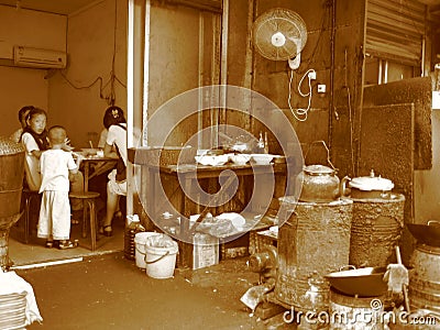 Chinese cafe on the street, poor family Editorial Stock Photo