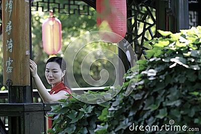 Chinese cheongsam model in Chinese classical garden Stock Photo