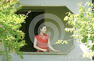 Chinese cheongsam model in Chinese classical garden Stock Photo