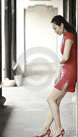 Chinese cheongsam model play in a famous garden Stock Photo