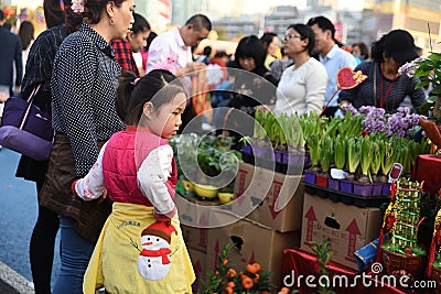 A Chinese child is visiting the new year market Editorial Stock Photo