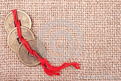 Chinese coins on the burlap background Stock Photo