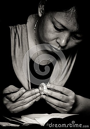 Chinese craftsman woman carving a stone with skills and craft Editorial Stock Photo