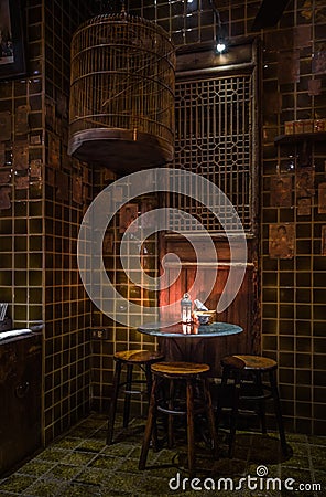 Chinese dining table set in the dark, Bangkok, Thailand. Stock Photo