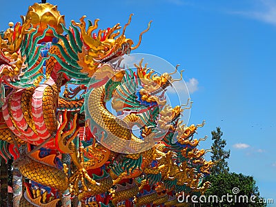 Chinese dragon statue climbing pole Stock Photo