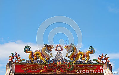 Chinese dragon statue climbing pole Stock Photo